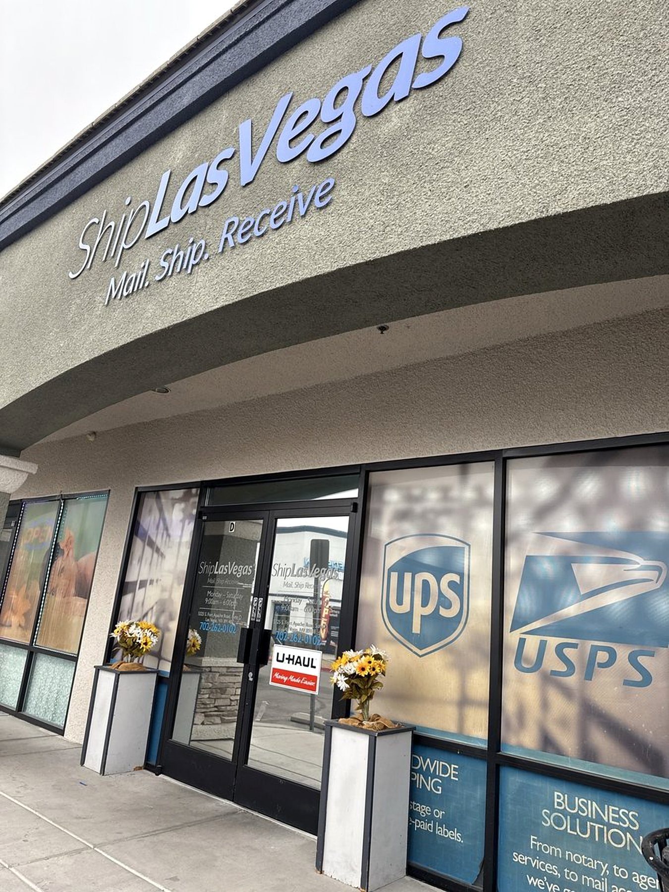 Ship Las Vegas storefront with Mail. Ship. Receive. signage and UPS and USPS logos on the windows