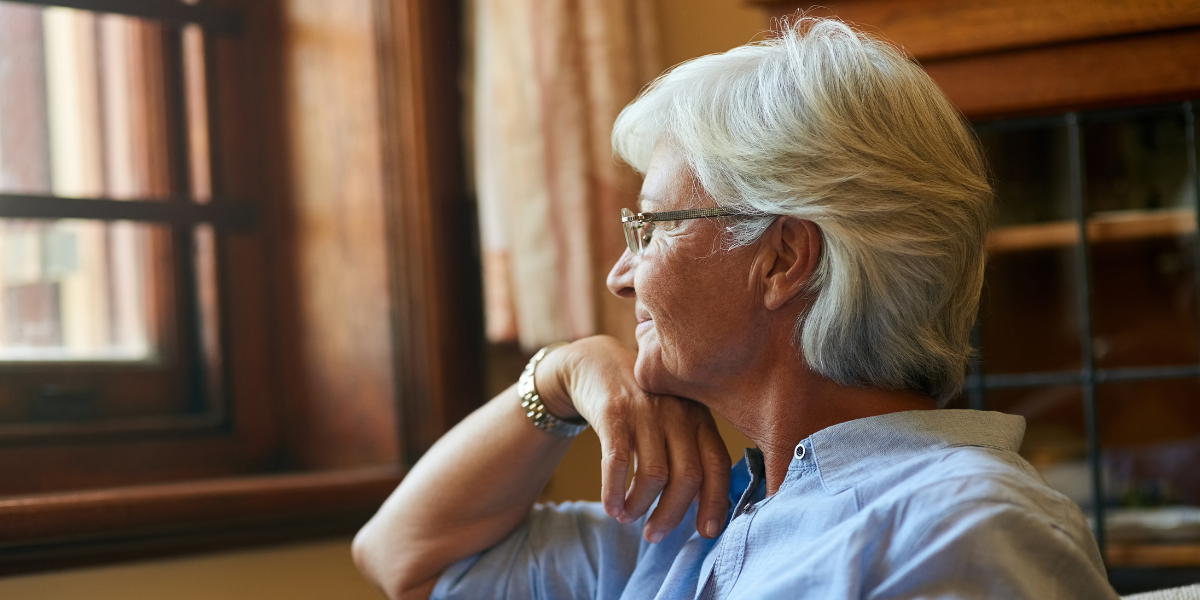 Person over 50 sitting calmly and reflecting, showing self-awareness after a dating experience
