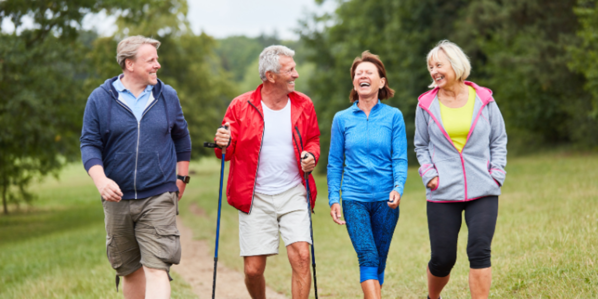 men and women over 50 walking and laughing showing love through quality time men and women over 50 walking and laughing showing love through quality time