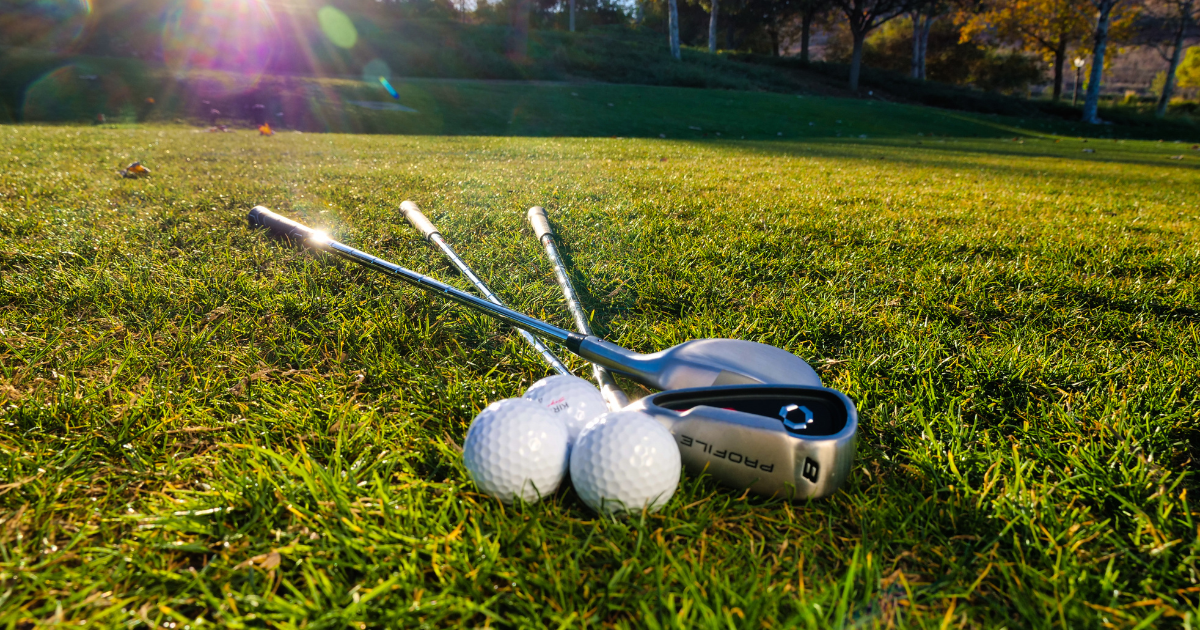 Golf clubs standing on a golf course, symbolising a child's intense focus on a new interest and the hope that it will make them feel happier or more successful. Golf clubs standing on a golf course, symbolising a child's intense focus on a new interest and the hope that it will make them feel happier or more successful.