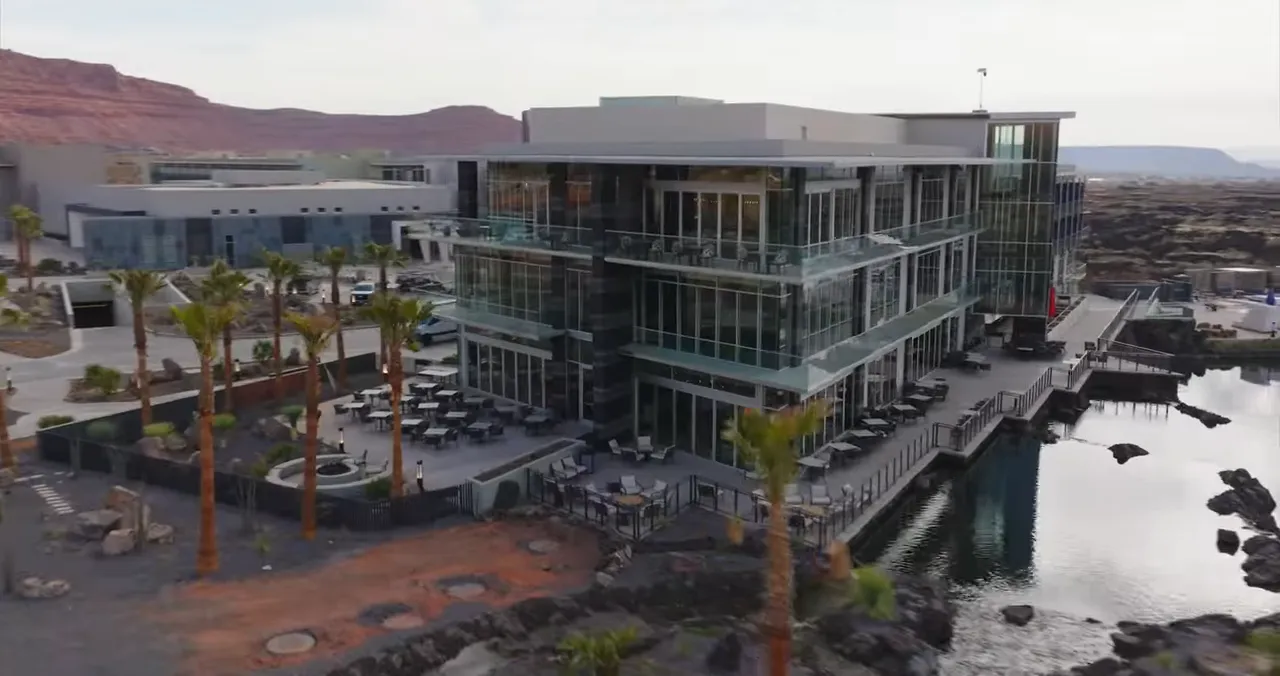 Black Desert Resort building beside a water feature and lava rock landscaping