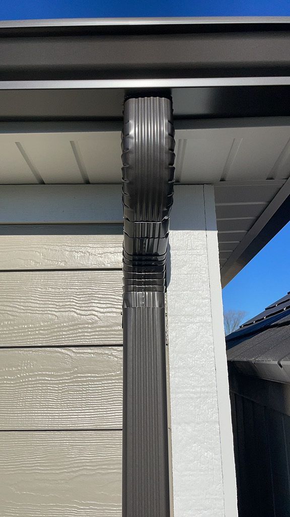 Seamless gutters and water management service