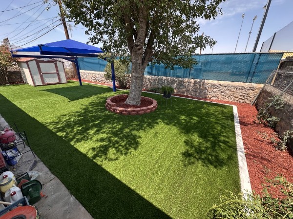 Completed turf installation with decorative rock border