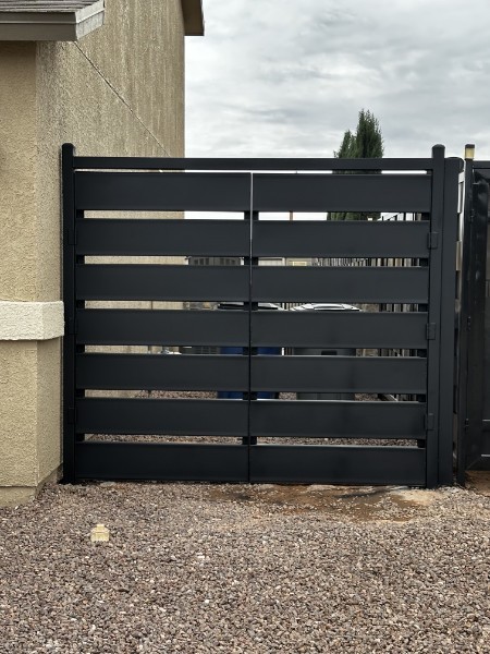 Black horizontal-slat double metal gate