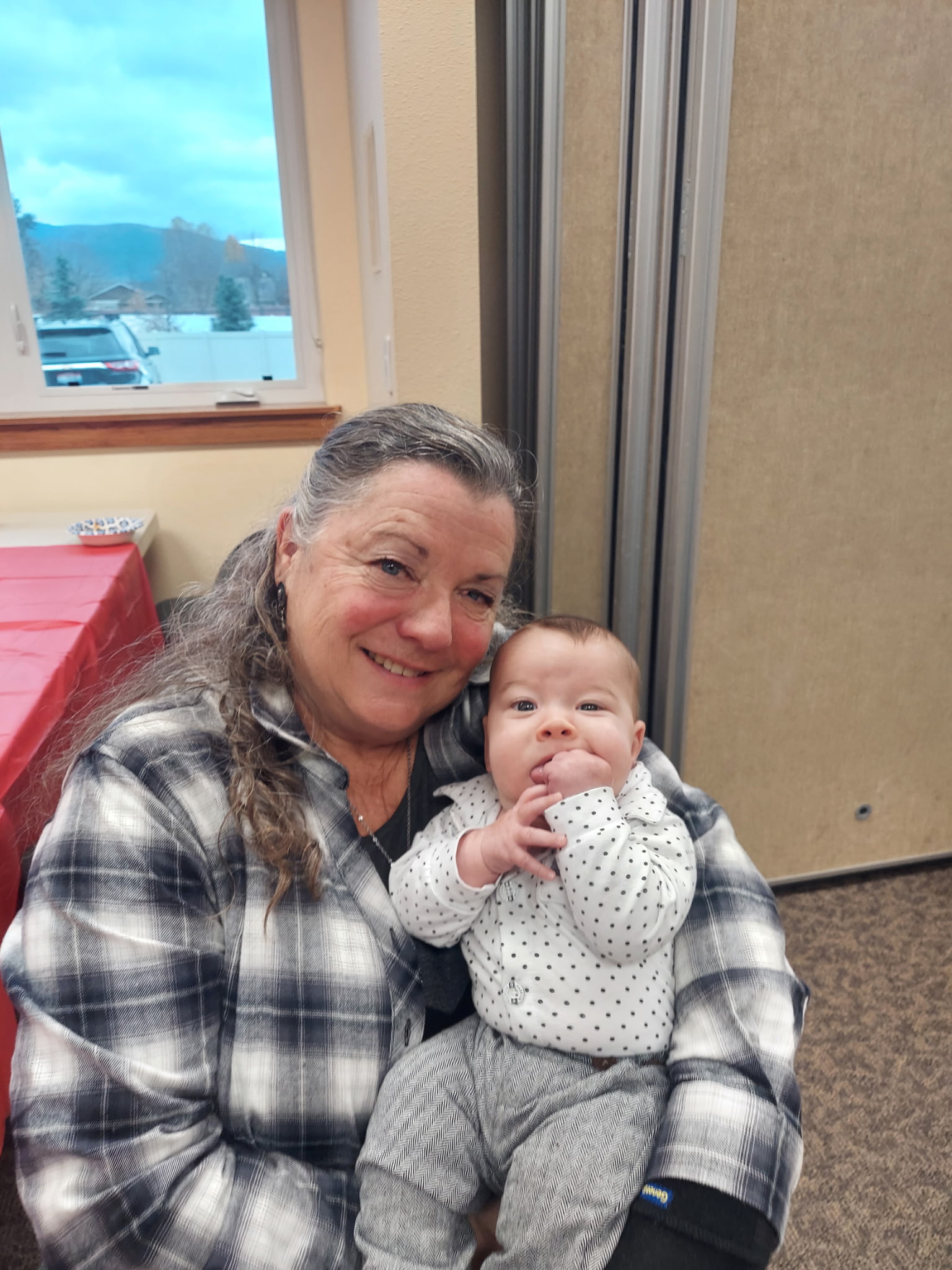 Charlotte with a baby grandchild