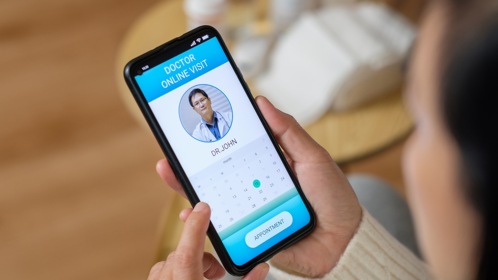 Person using a smartphone to arrange a chiropractic appointment