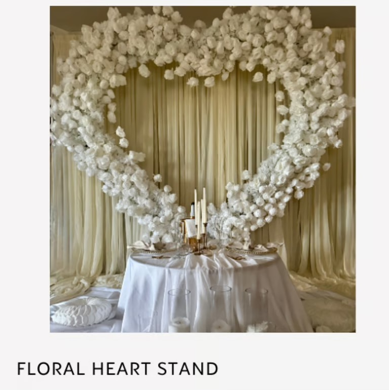 White heart-shaped arrangement with gold accents