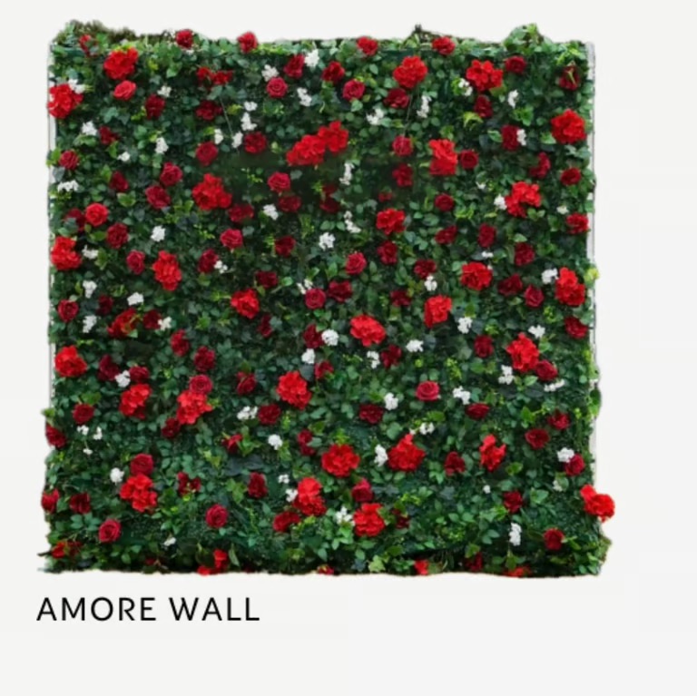Green foliage with red roses & white blooms