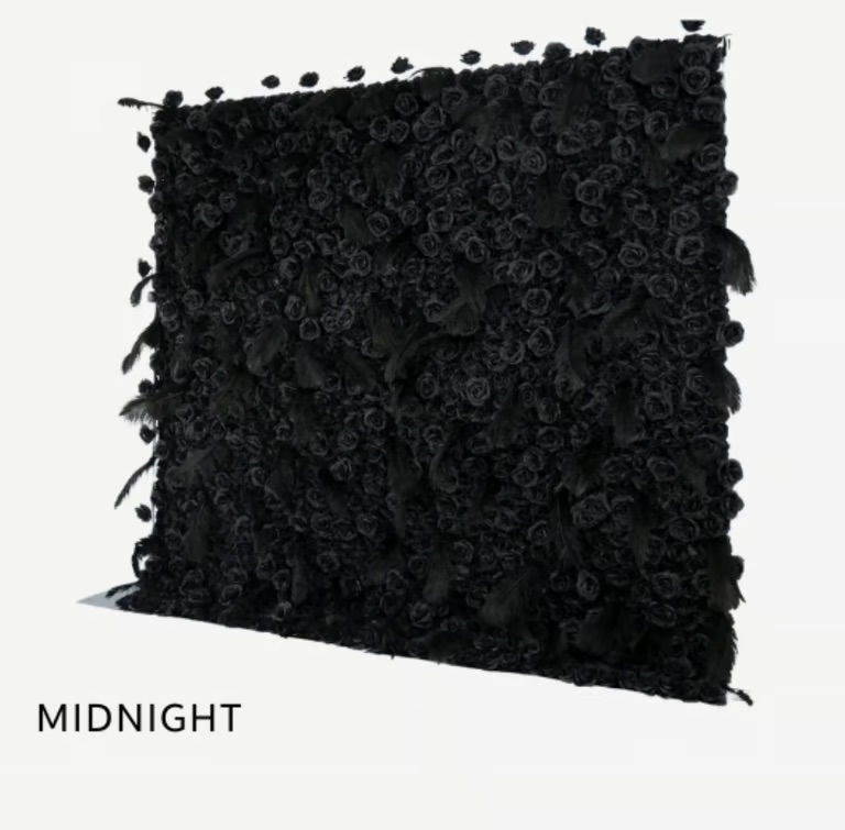Black decorative pillow with textured rose pattern
