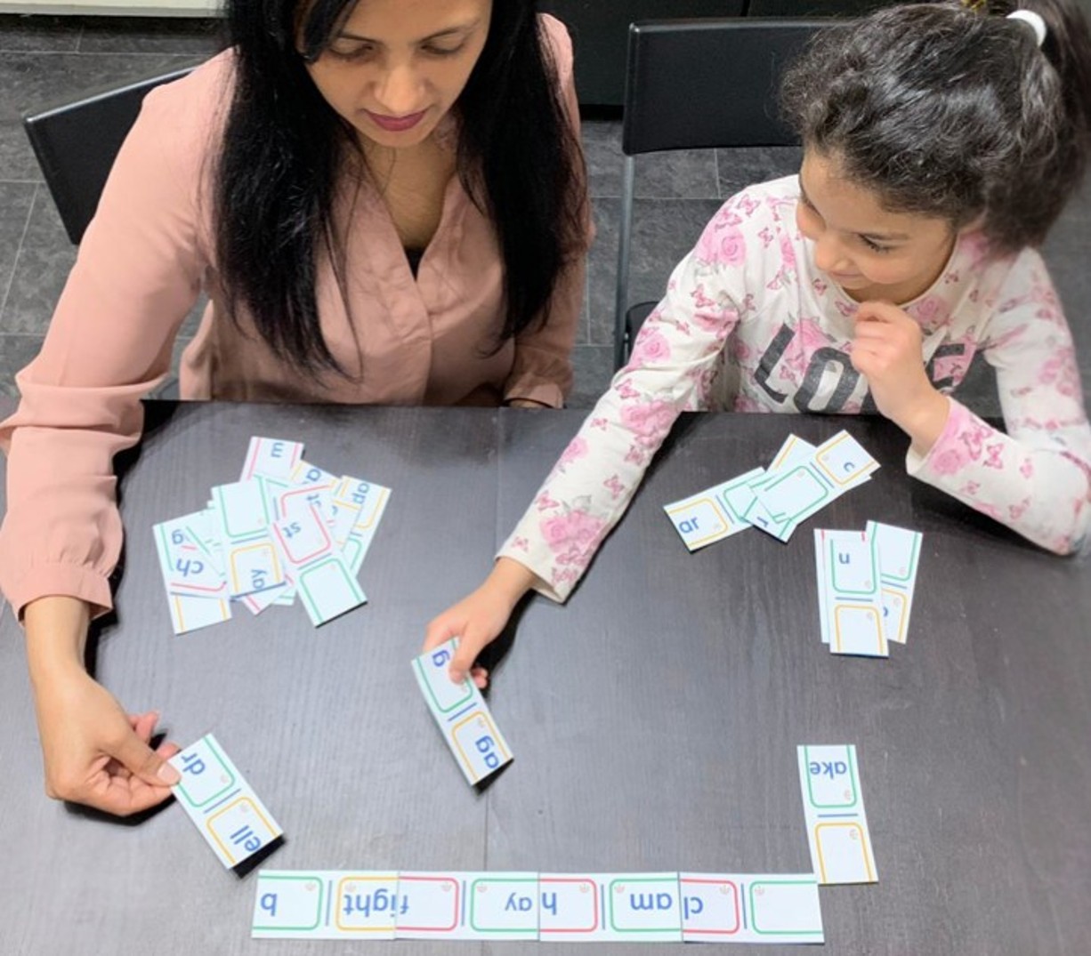 Sabina Bashir working with a child at home