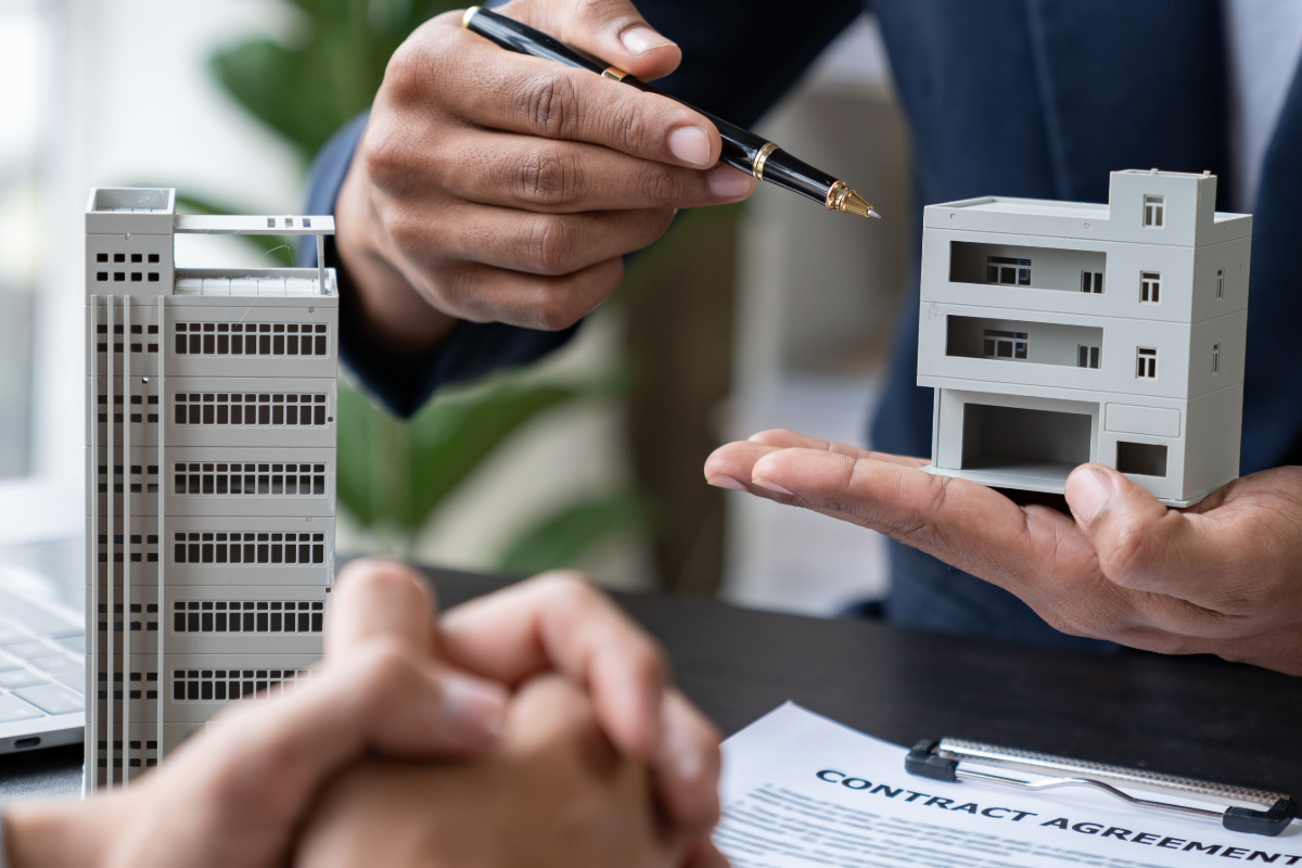 Growth — handshake over building model