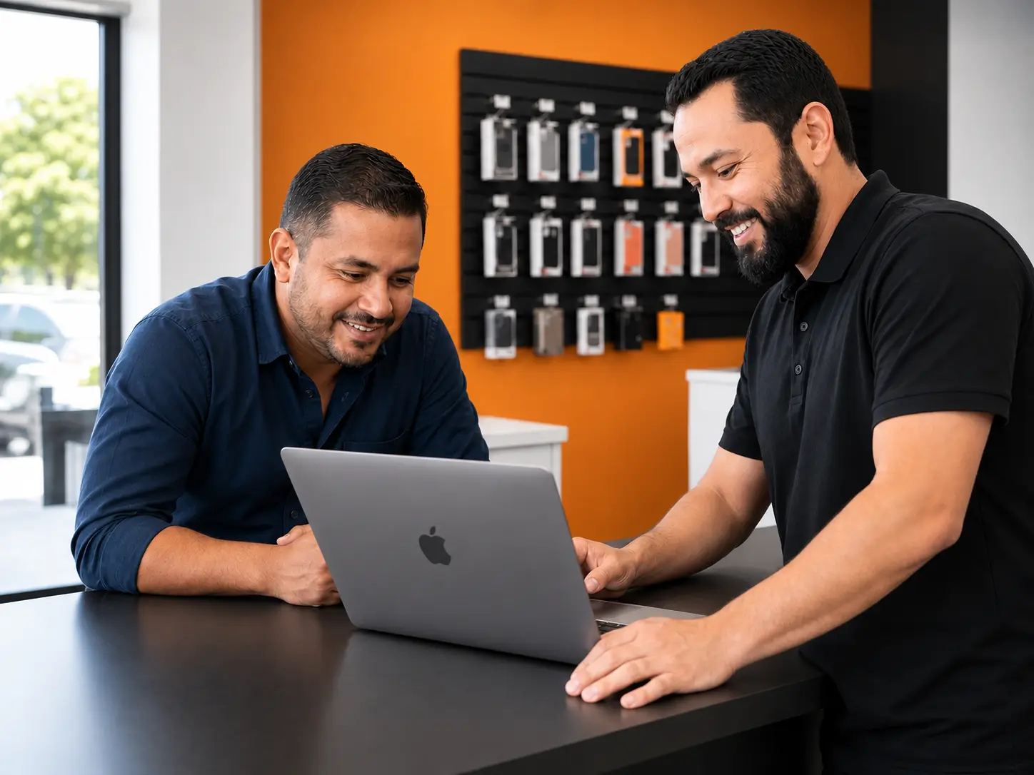 A Salem Geeks tech helping a customer with a laptop