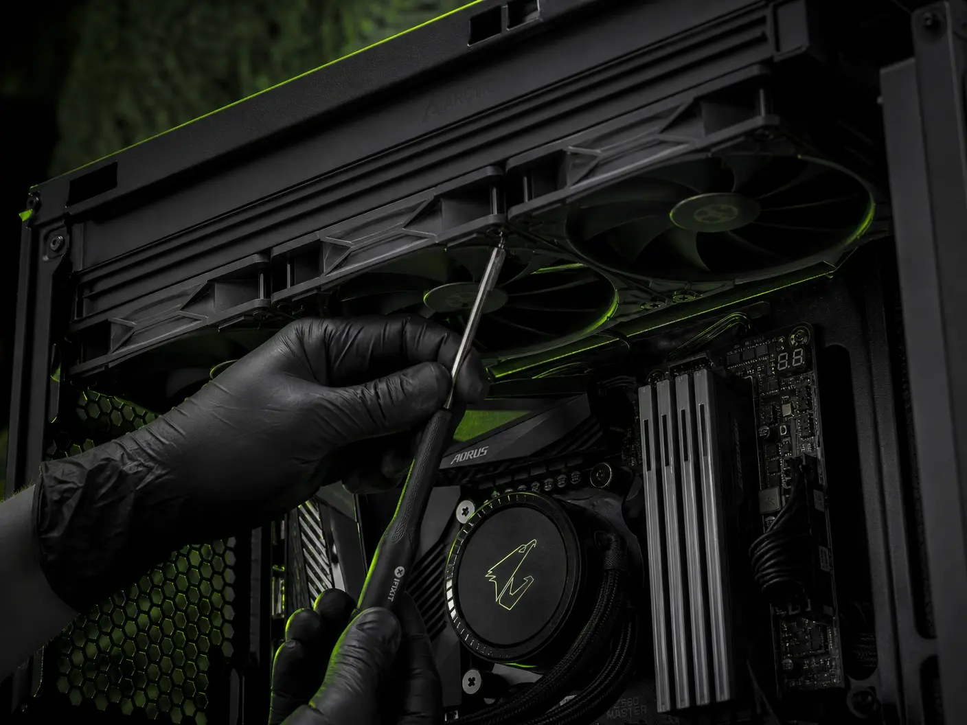 A technician working inside a desktop PC at Reboot Computers in Salem
