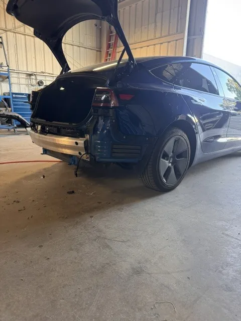 Collision repair technician at work