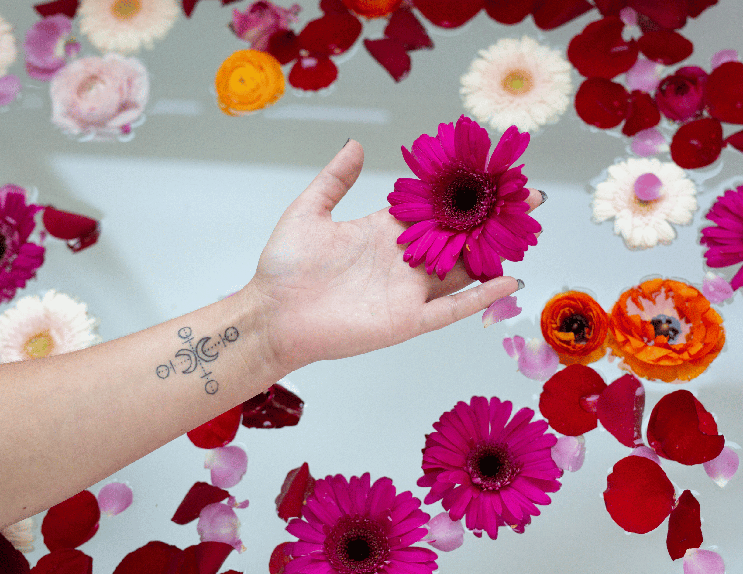 A prepared ritual bath with flower petals