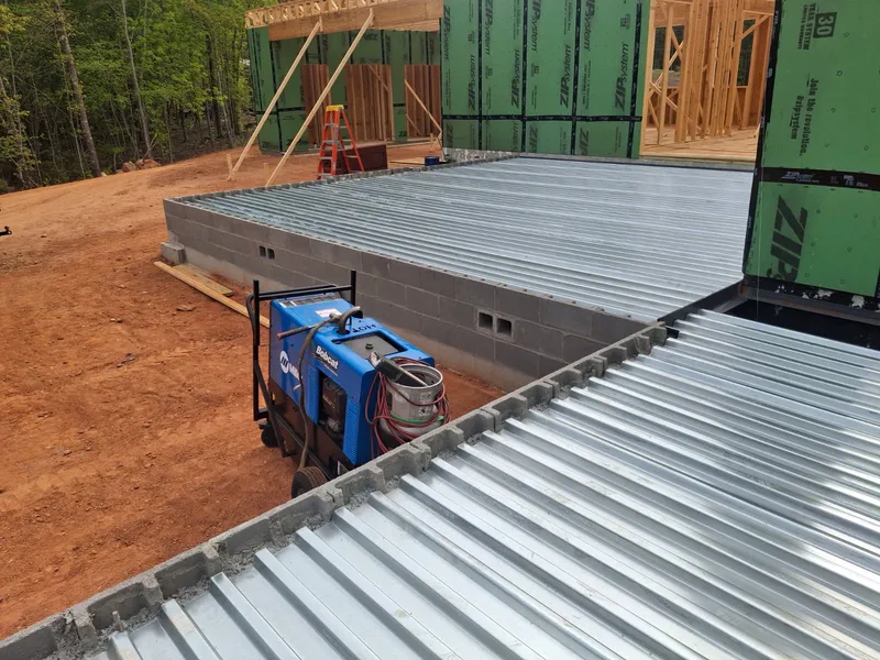 Metal decking laid over steel framing on a house under construction