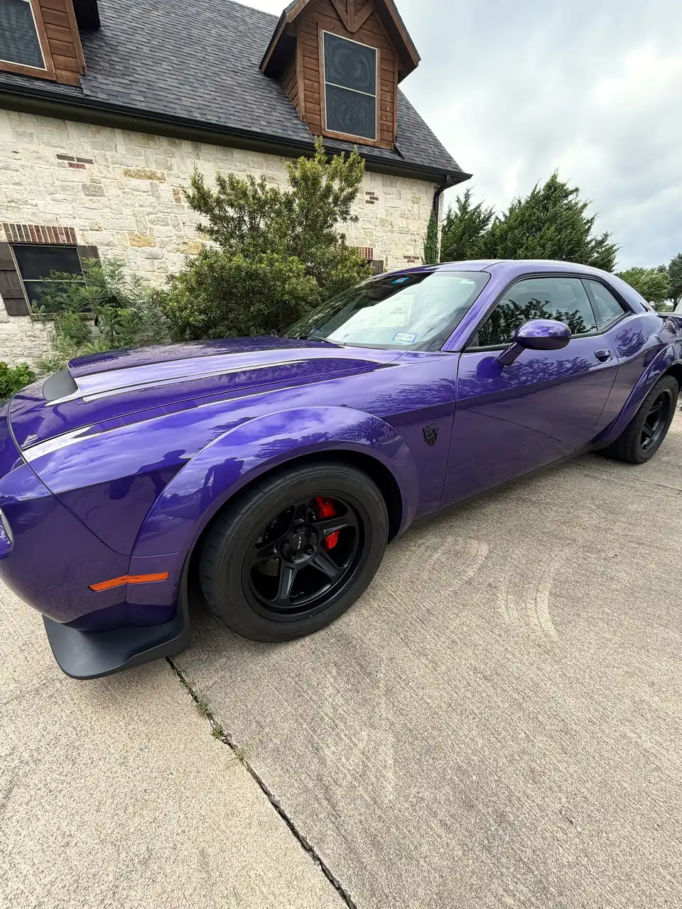 Plum Crazy Dodge Challenger Demon with glossy paint after a detail in DFW