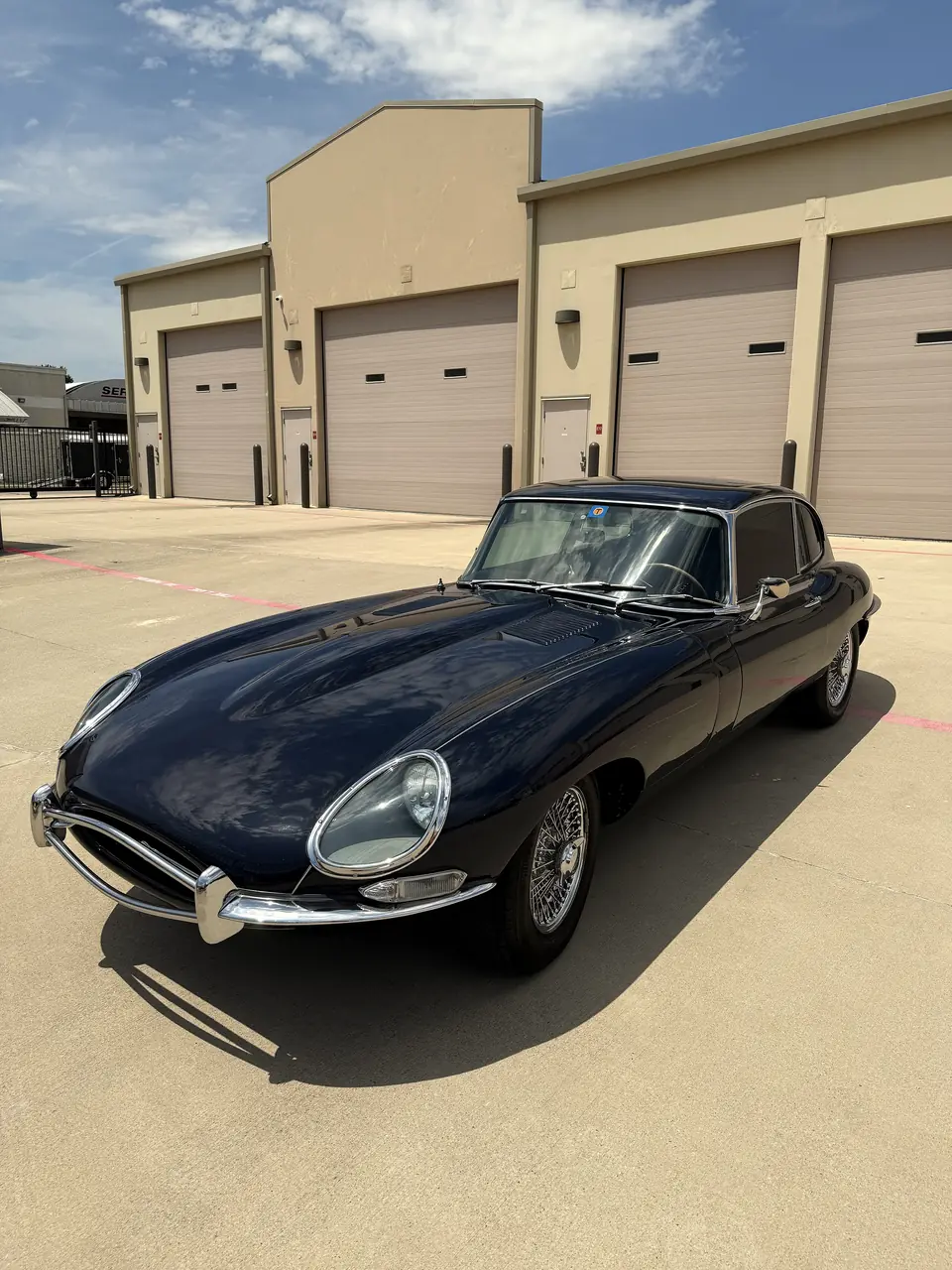 Dark blue Jaguar E-Type after a detail in Dallas-Fort Worth