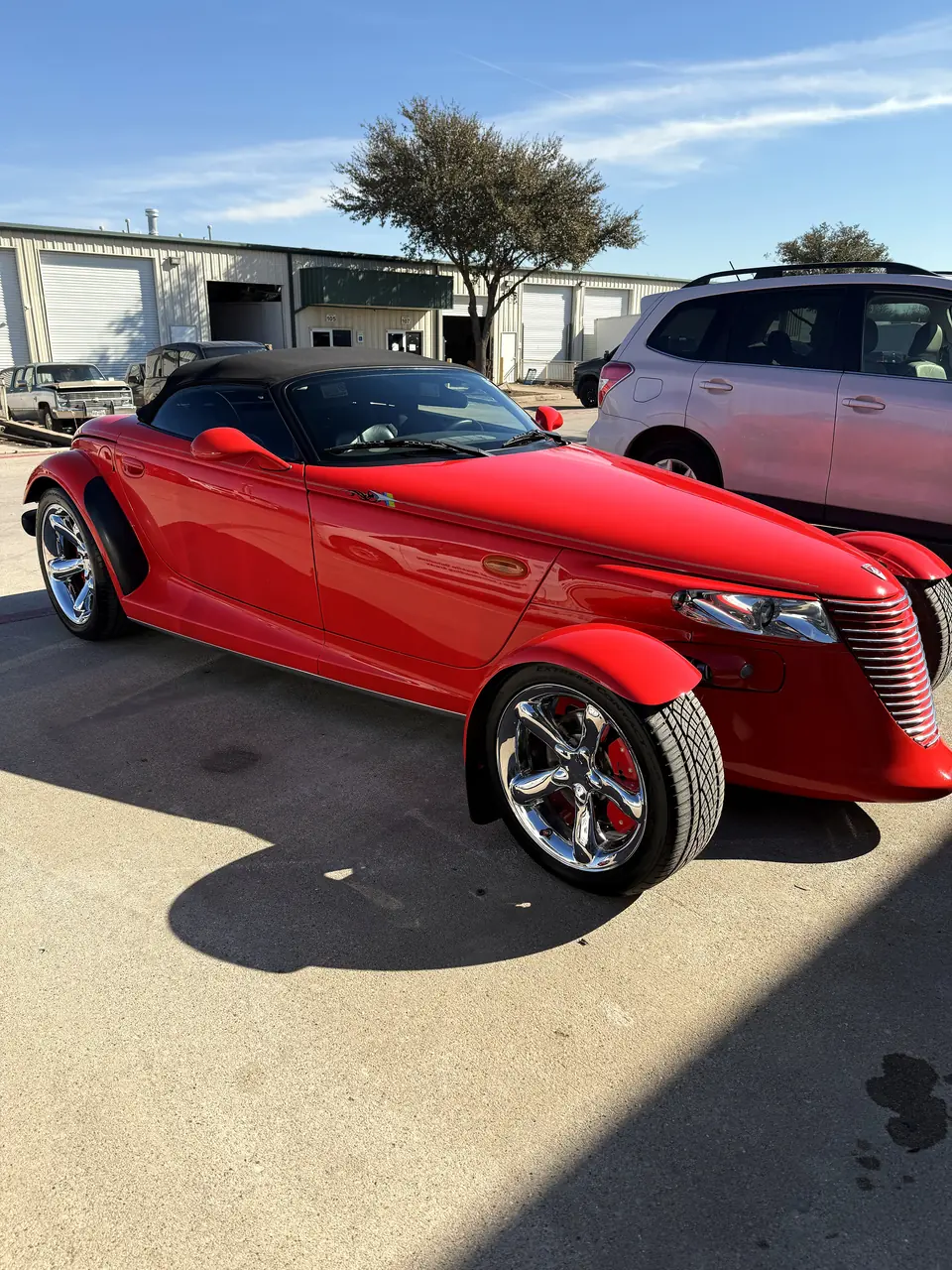 Red Plymouth Prowler with glossy paint after a detail in DFW