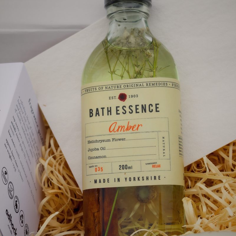 Bath essence bottle nestled in a hamper