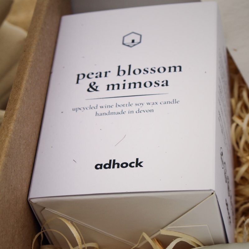 Boxed candle wrapped in paper straw