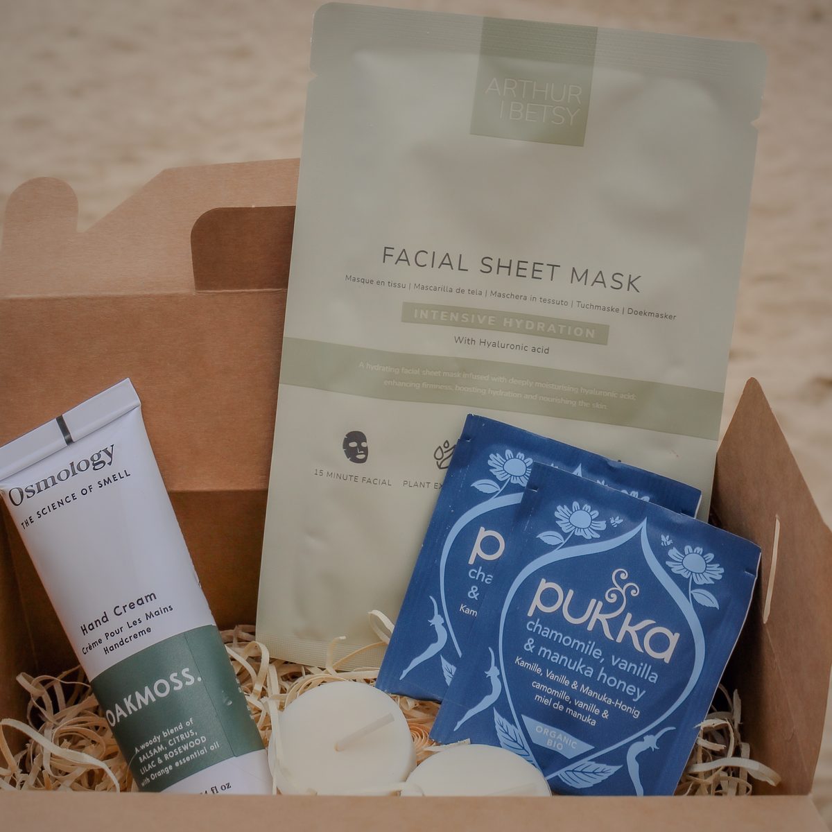 A gift box of teas, hand cream and a sheet mask