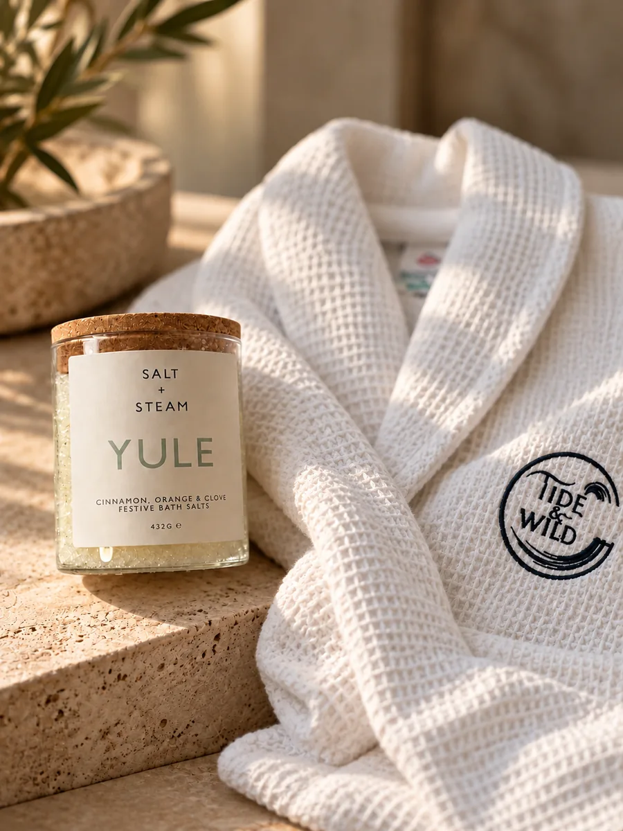 Yule bath salts beside a Tide & Wild waffle robe