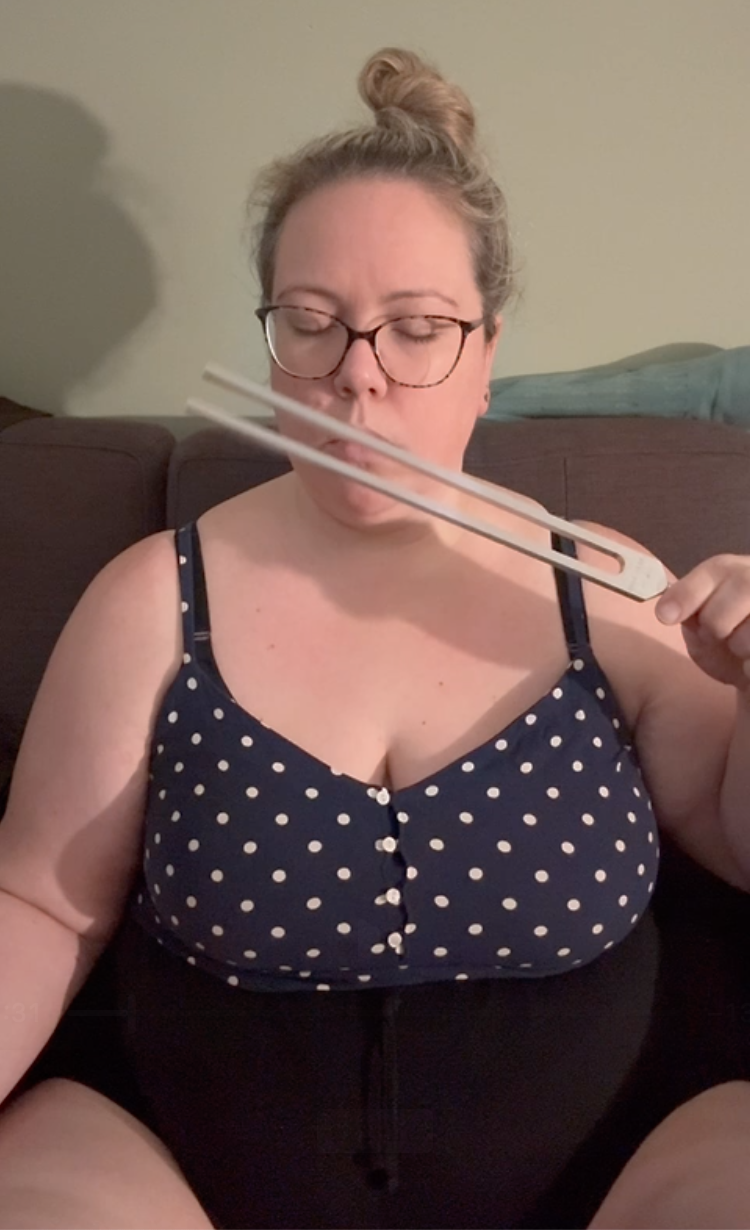 Karolina using the low om tuning fork