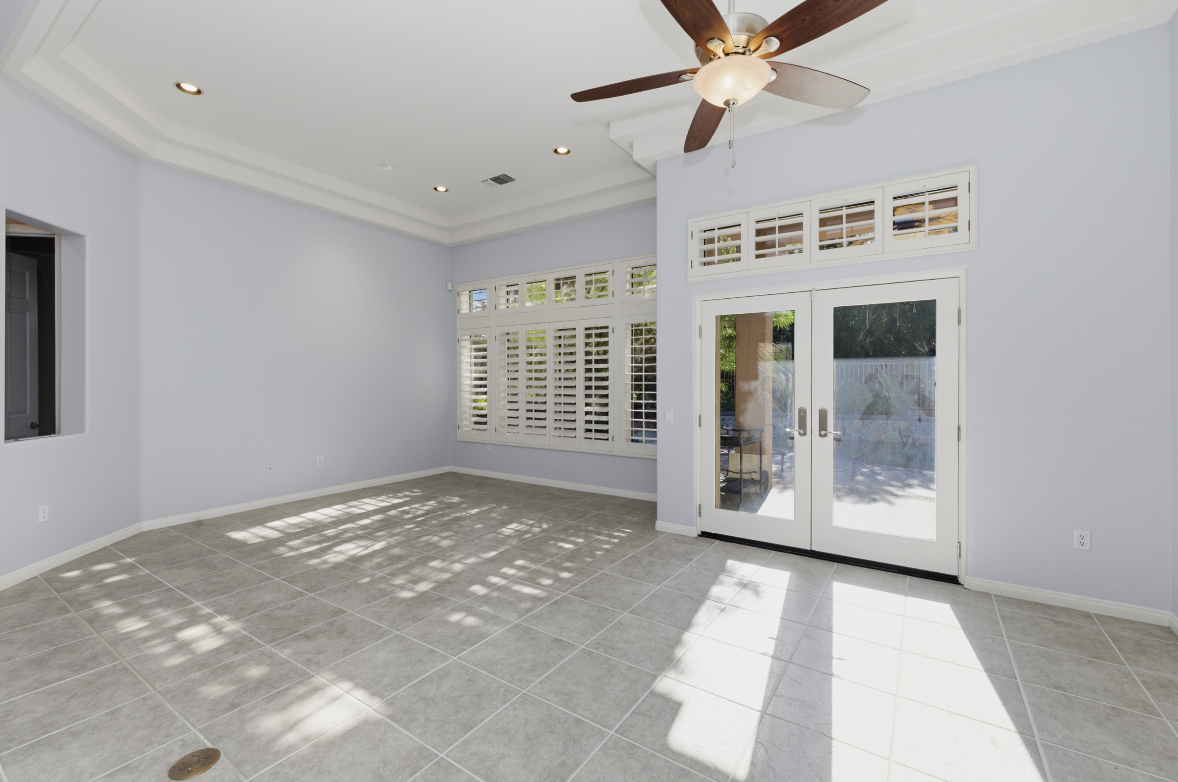 The empty sunroom before staging