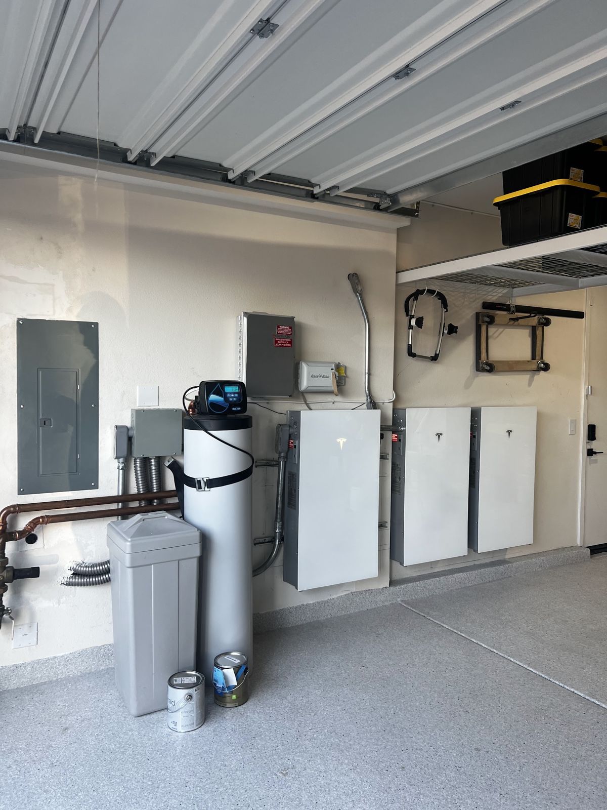 Tesla Powerwall batteries installed in a garage by Nueva Energy