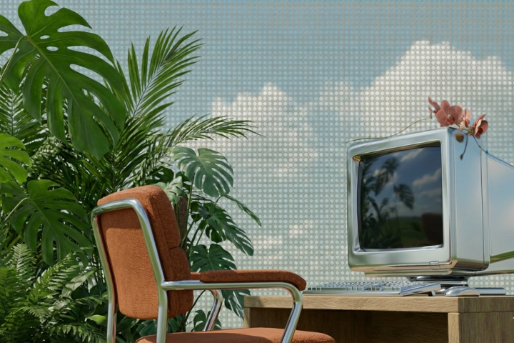 Chrome monitor in a jungle scene with orange chair