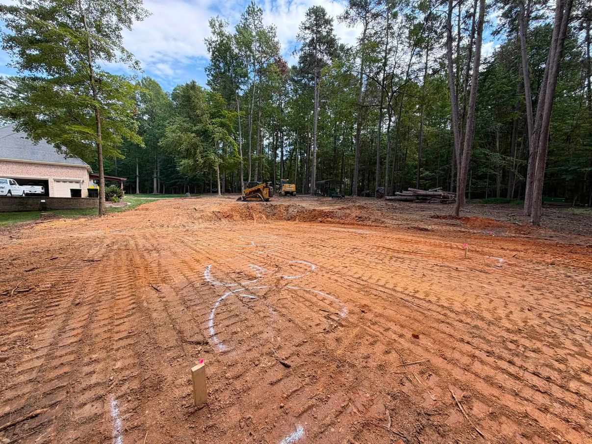 Grading equipment leveling ground on a North Carolina property