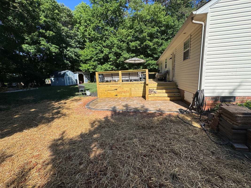 Construction site with framing and groundwork underway on a North Carolina property