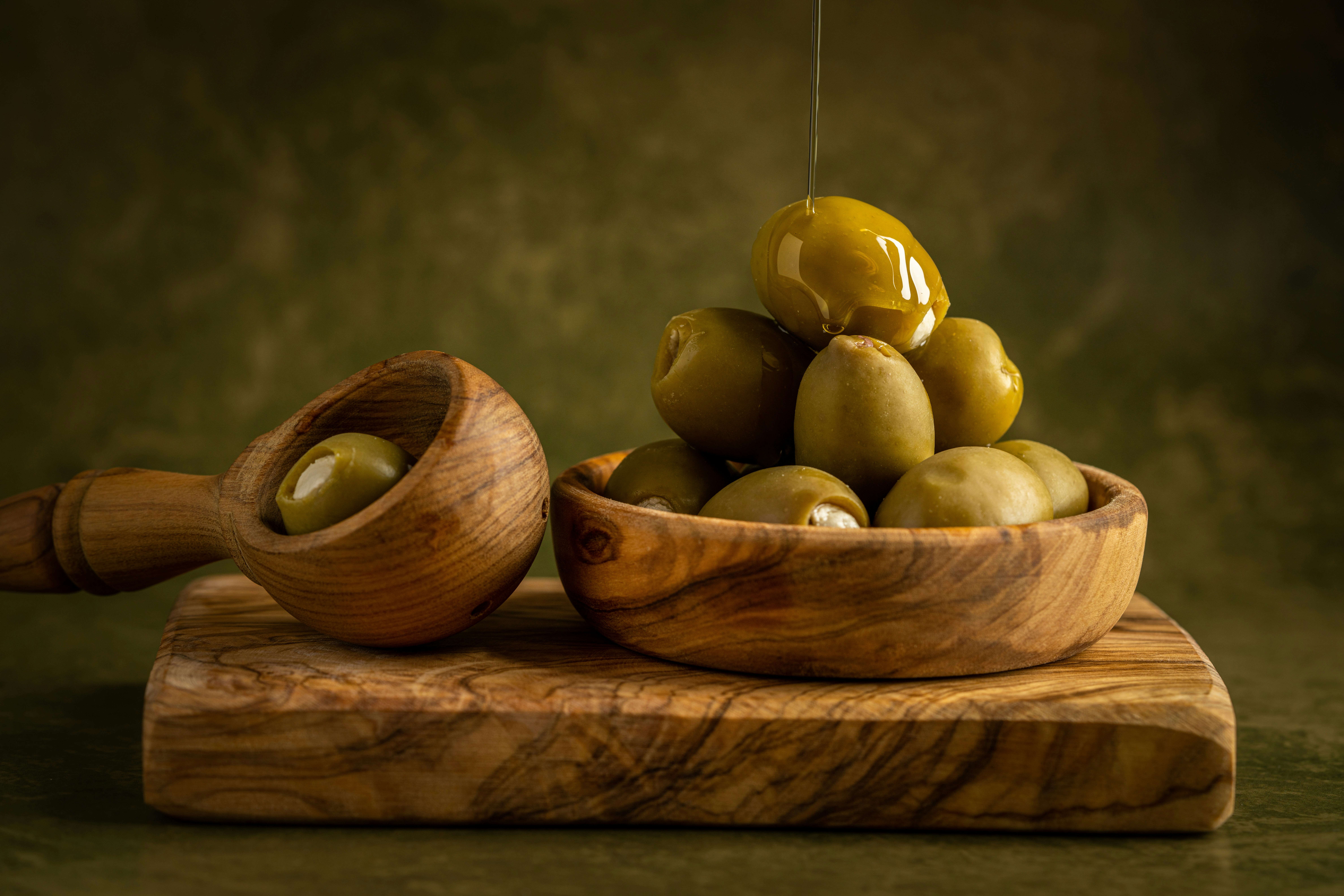 Healthy fats source — olives and olive oil representing clean keto nourishment and hormone balance in women’s metabolism program.