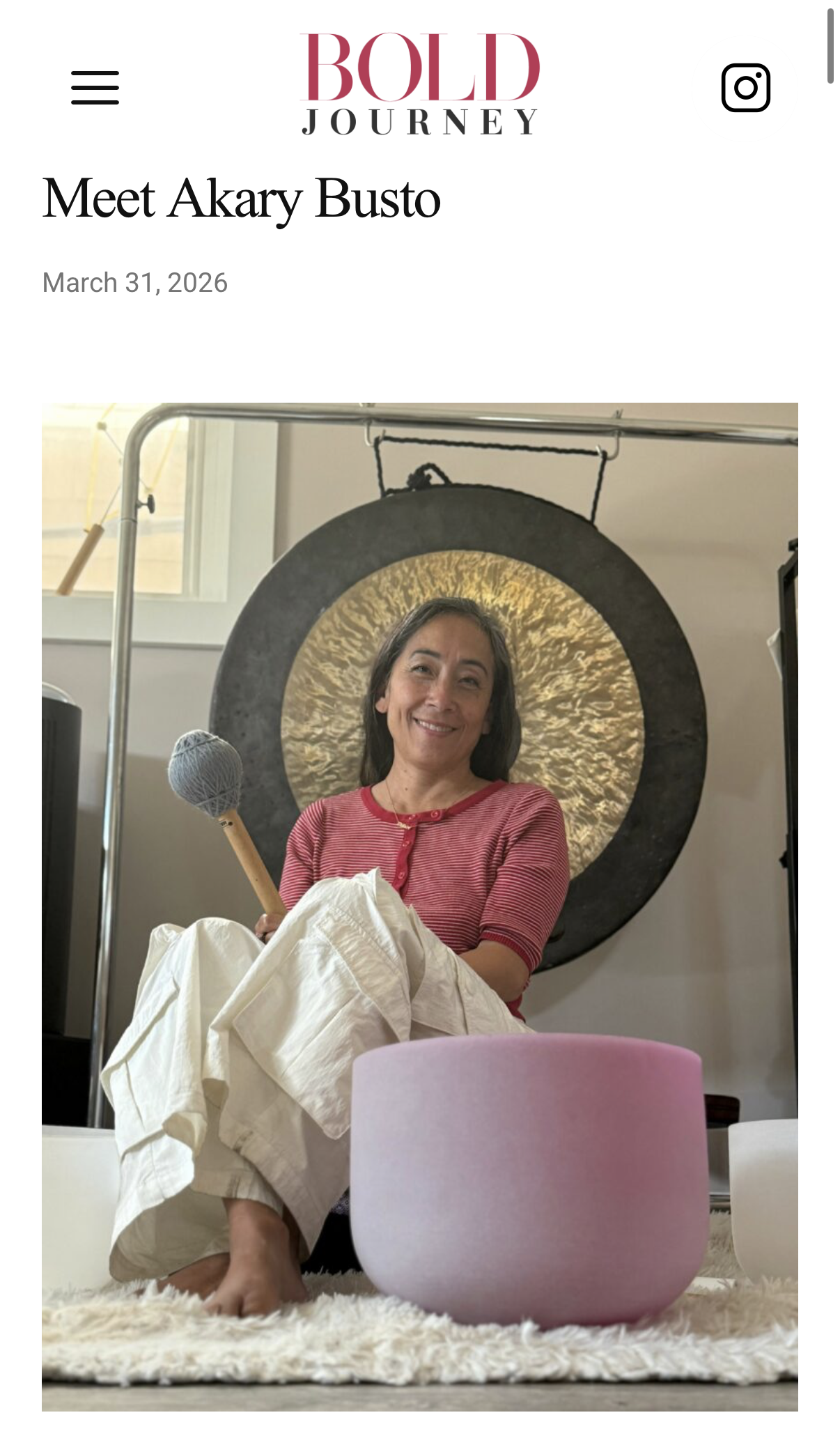 Akary playing a sound bowl and gong Akary playing a sound bowl and gong