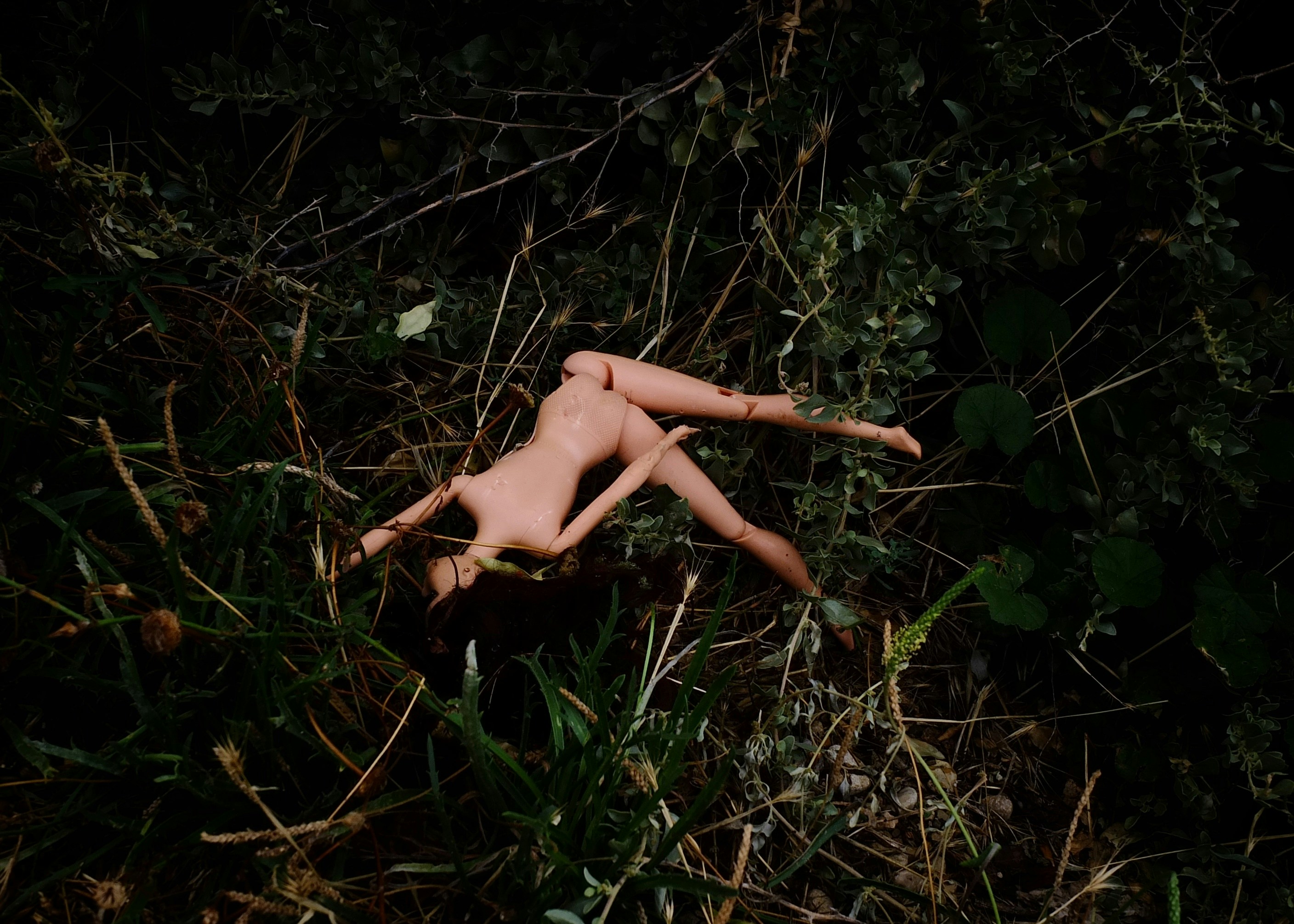 broken and abandoned doll