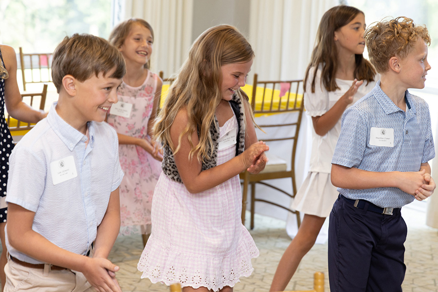 Young ladies and young gentlemen students grades 1-5 learning line dance and smiling having a good time at NLJC Pre-Cotillion Nashville, TN 