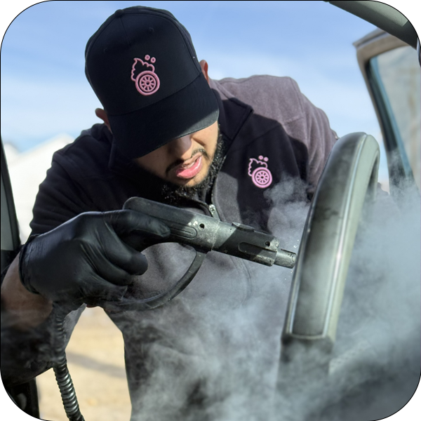 Casa Detailing team steam cleaning a vehicle interior