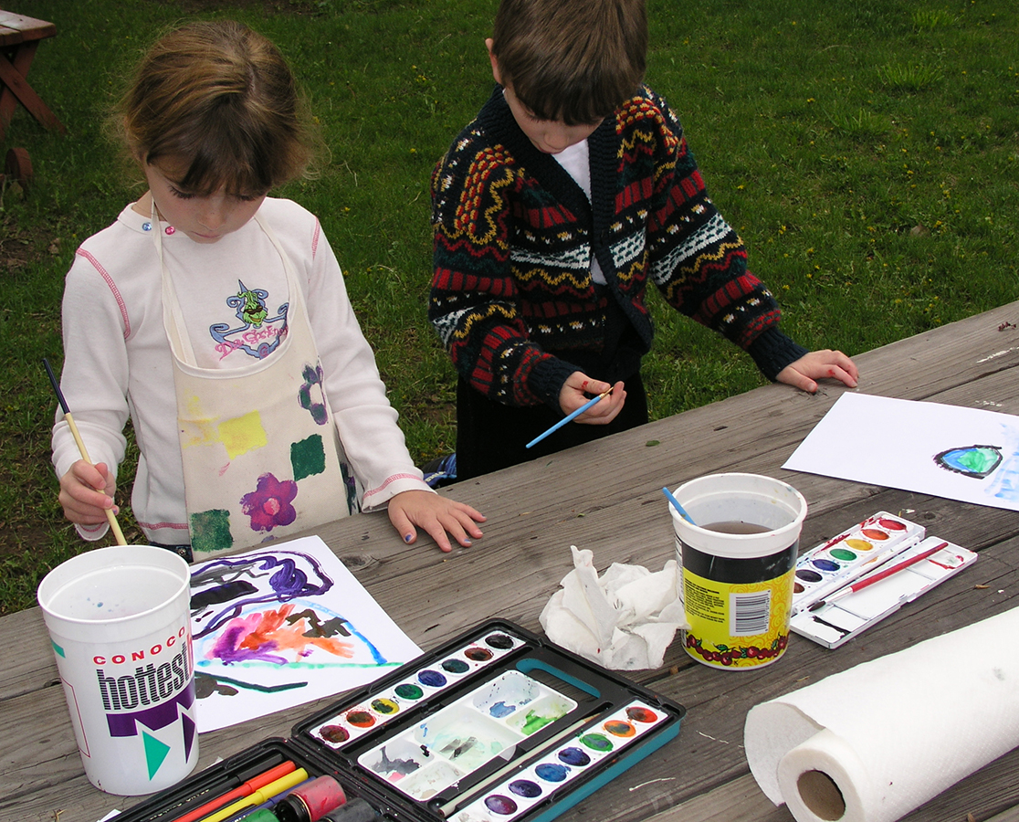 A young artist concentrating on a drawing exercise