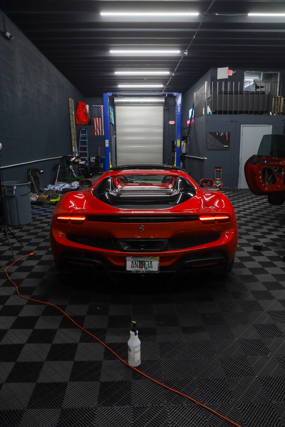 Red Ferrari in the install bay