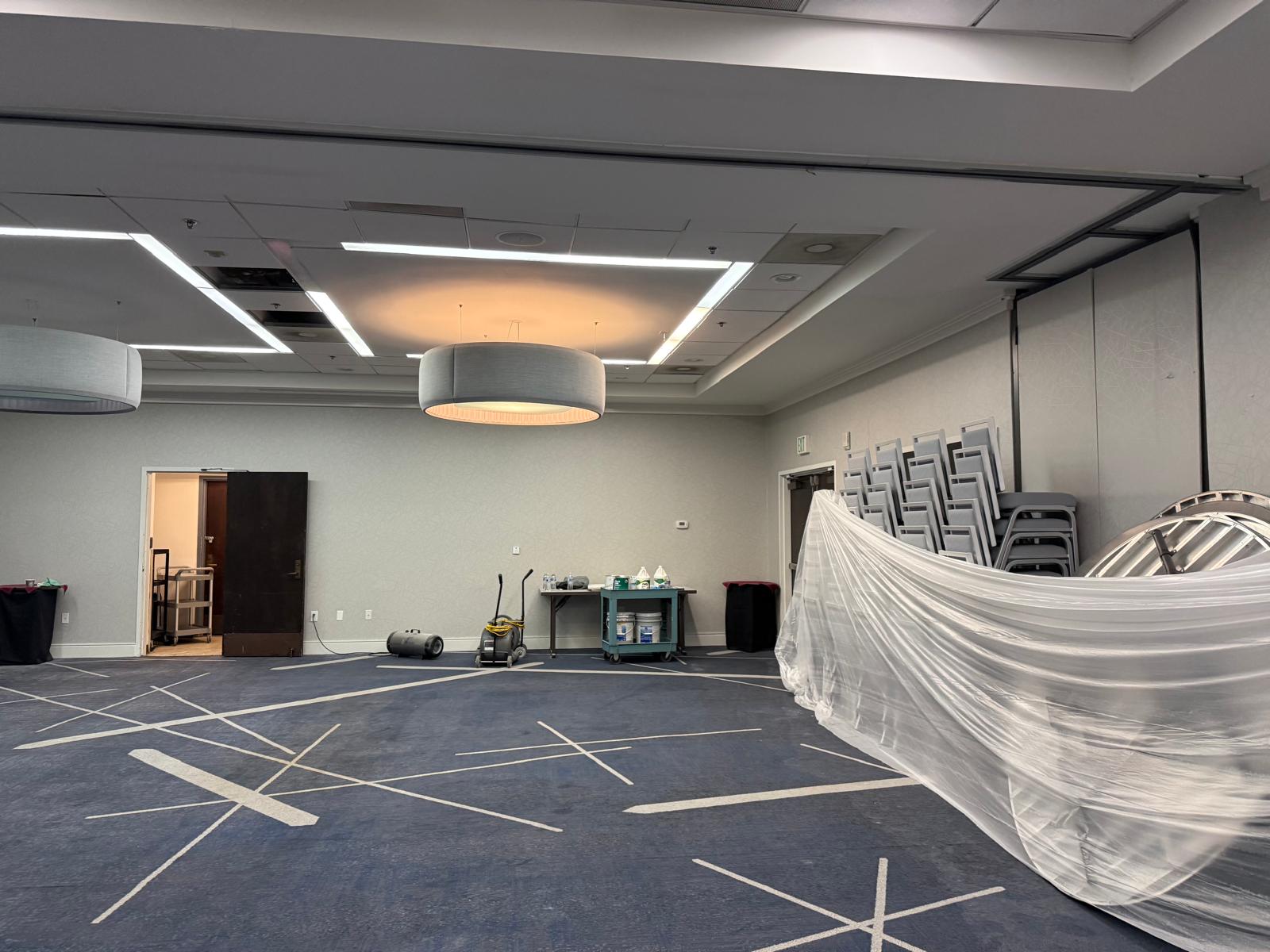 A skilled remodeler installing a modern light fixture in a newly renovated room