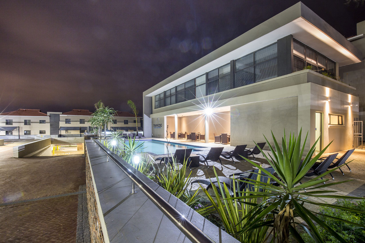 Savannah Park pool and building exterior at sunset
