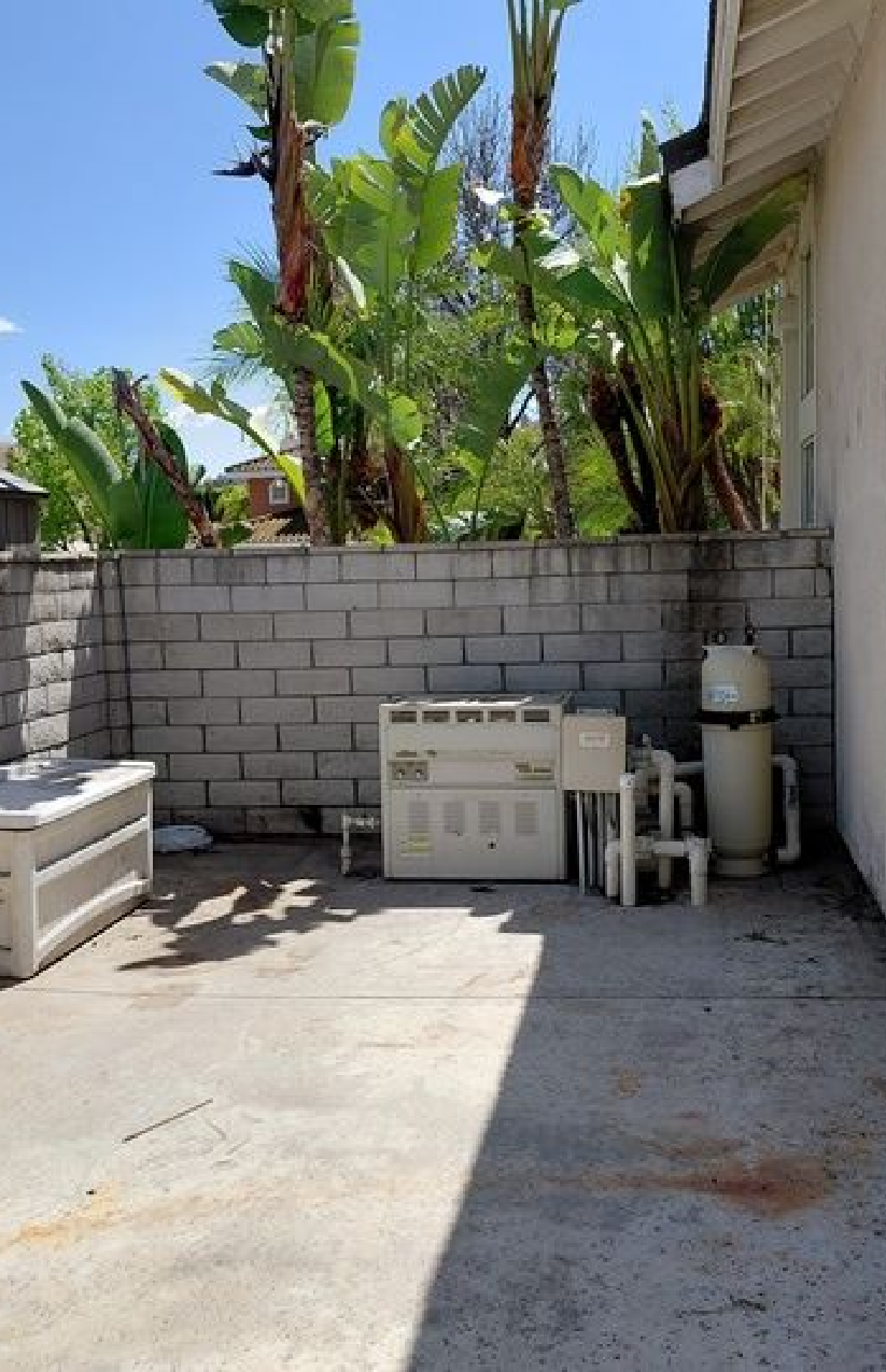 After junk removal by Rabbits Services, showcasing clean and cleared yard with no debris or furniture