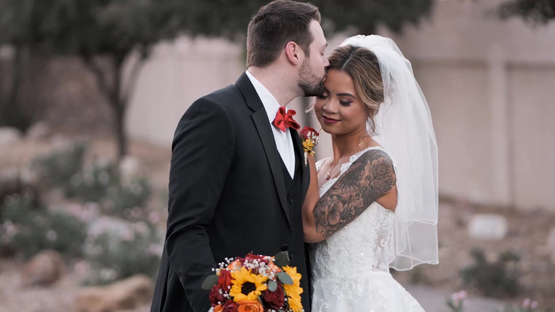 Couple laughing under string-light canopy