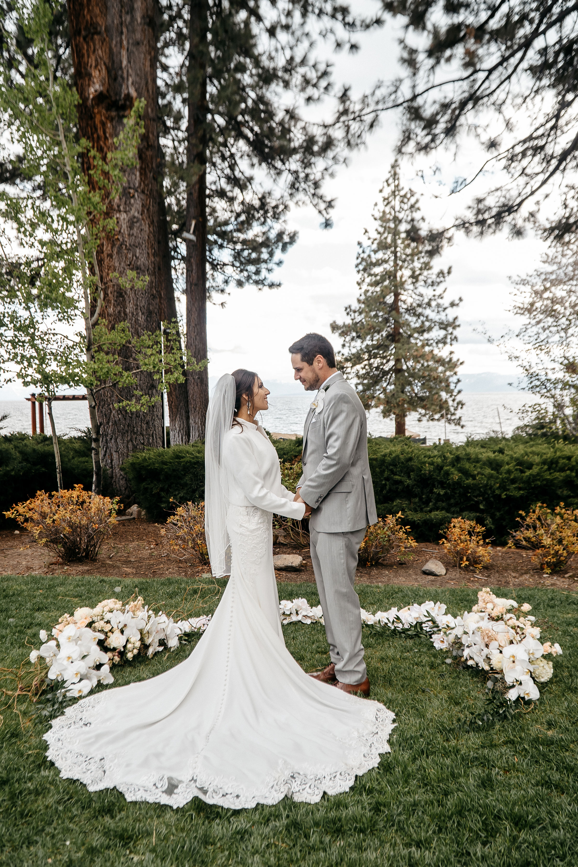 Bride and groom walking down a desert path