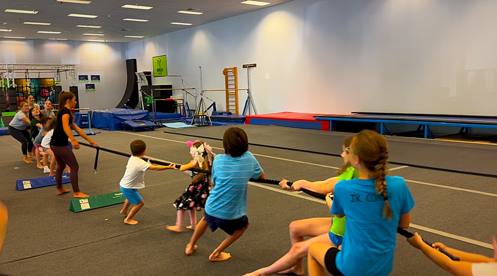 Campers playing tug of war in the gym