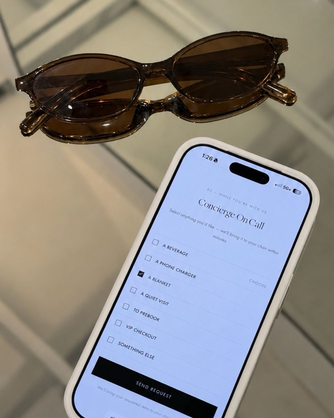A phone showing the Concierge On Call guest request form