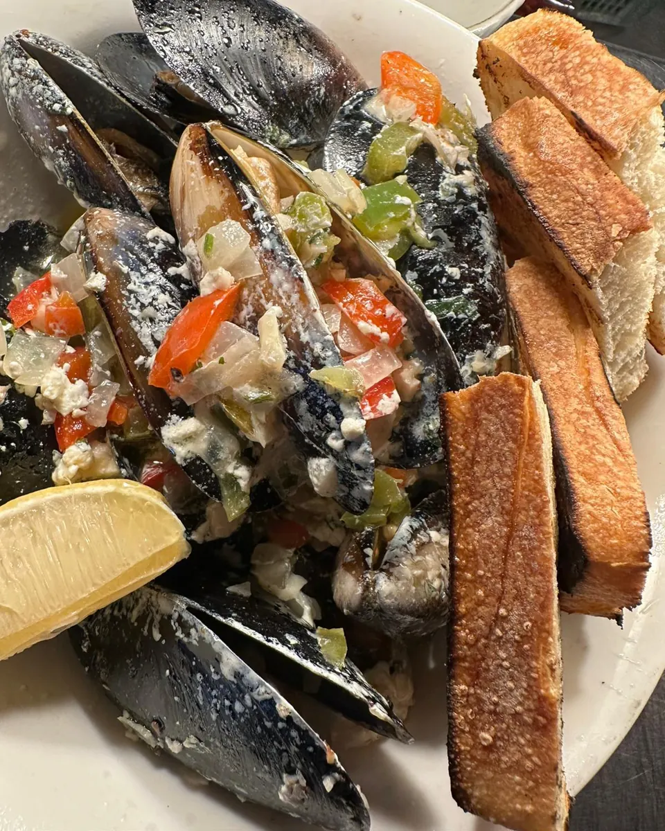 Saganaki mussels in white wine with feta and charred sourdough