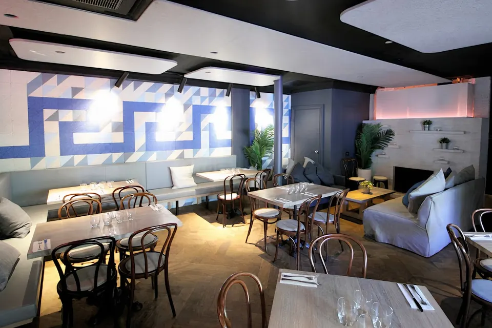 The Nest function space with its fireplace, sofa nook and Greek-key feature wall