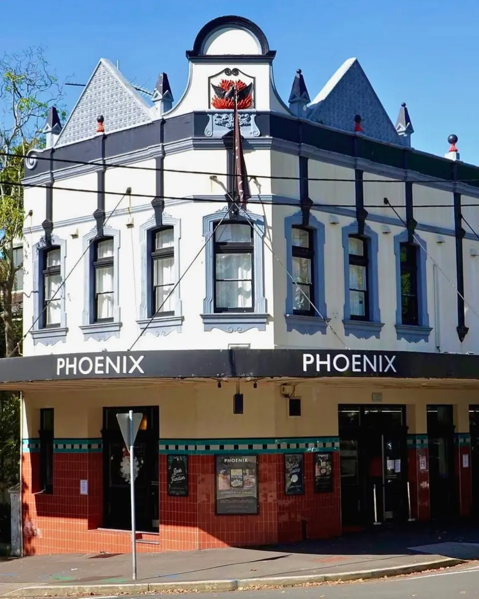 The Phoenix's Victorian corner facade on Moncur Street, Woollahra, with the red phoenix crest on the gable
